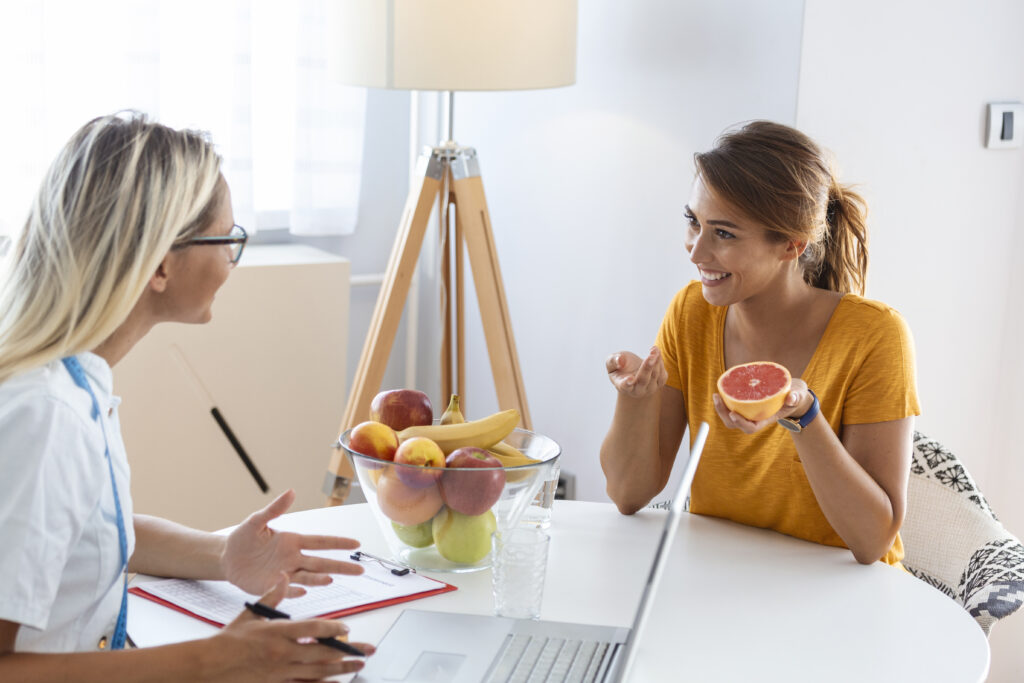young woman visiting nutritionist in weight loss clinic